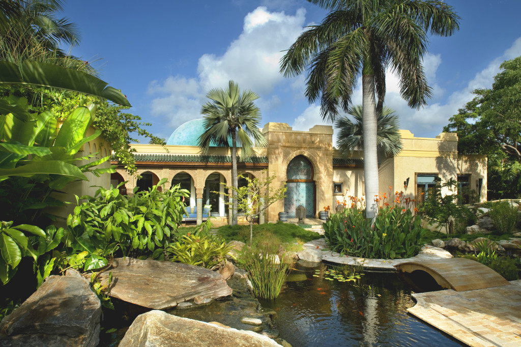 Expansive ornamental grounds afford unparalleled indoor/outdoor living.