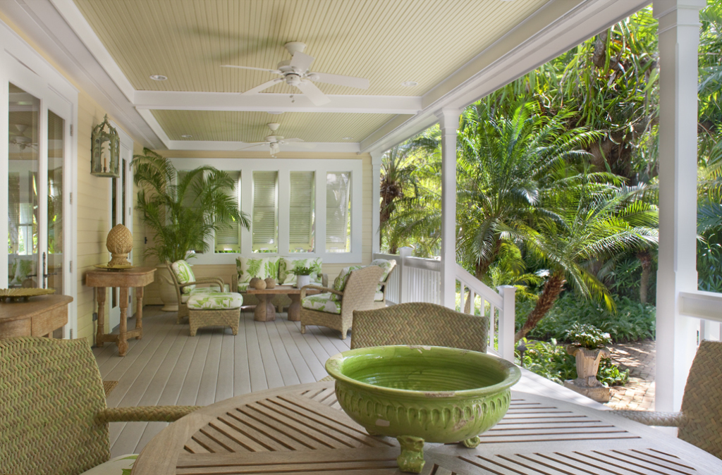 The generous front porch overlooks a secluded tropical garden.